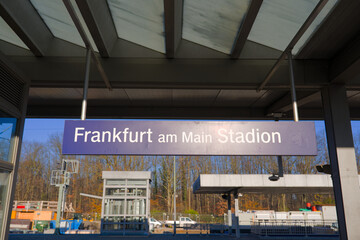 Blue sign at railway station Frankfurt am Main Stadion on an autumn day. Photo taken November 22nd, 2025, Frankfurt am Main, Germany.