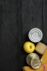 Humanitarian aid. Different food products for donation in crate on wooden table