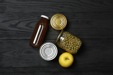 Humanitarian aid. Different food products for donation in crate on wooden table