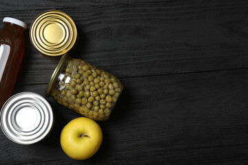 Humanitarian aid. Different food products for donation in crate on wooden table