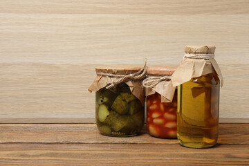 Humanitarian aid. Various food products for donation on wooden table
