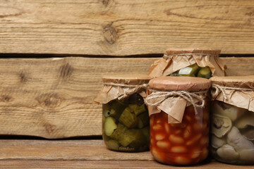 Humanitarian aid. Various food products for donation on wooden table
