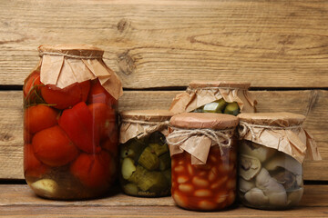 Humanitarian aid. Various food products for donation on wooden table
