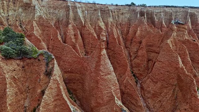 Aerial drone descending over natural park gullies