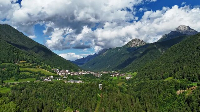 Spectacular aerial drone hyperlapse flying over the vast Val di Scalve. Majestic panoramic view of the Orobie Alps and mountain valley in Italy