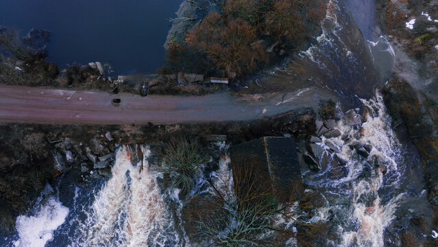 water flood ecology disaster aerial drone view photography of abandoned depressive country side land destroyed road along river space