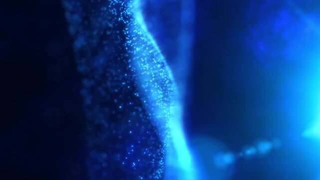 Glowing particles forming soft blue waves
