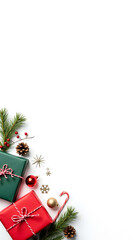 Red, green gift boxes and other Christmas decorations on white backdrop
