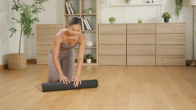 Asian female practicing home yoga meditation, deep breathing exercise for mental health, mindfulness, wellness, emotional healing, calm relaxation, balance, healthy lifestyle and peaceful well-being