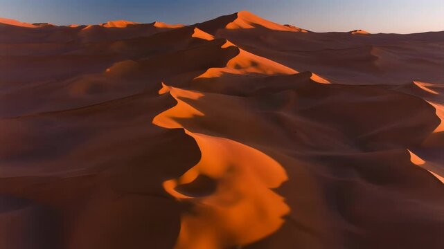 Aerial View of Rolling Sand Dunes in the Desert Landscape at Sunset