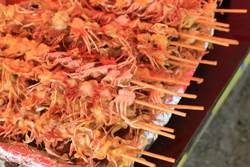 Close-up of Crispy Deep-Fried Mini Crabs on Skewers, Korean Street Food