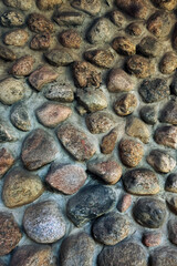 wild stone dirty grey-brown colors wall, abstract natural texture background. fragment of old stone wall made of rough wild cobblestones. template for design