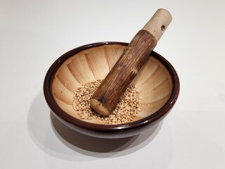 Sesame Seeds or Perilla Seeds in Traditional Korean Ceramic Bowl and Mortar