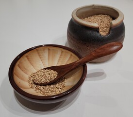 Sesame Seeds or Perilla Seeds in Traditional Korean Ceramic Bowl and Mortar