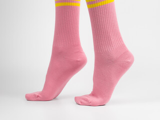 A cozy and comfortable photo of women's feet in soft socks. Colorful cotton socks.