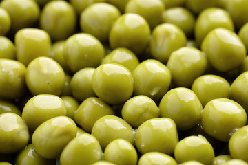 Fresh green peas background, texture of perfect peeled sweet pea grains as background. Vegetable background, vegetable protein, healthy products. Canned peas. spinning in a circle