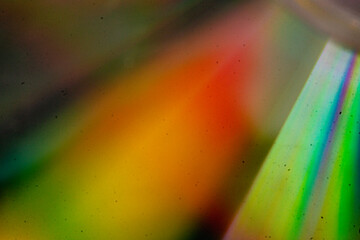 Abstract vintage-style background featuring textured grain, dust, scratches, and soft colorful light effects. Aged analog aesthetics create a dynamic, distressed atmosphere suitable for cinematic and 