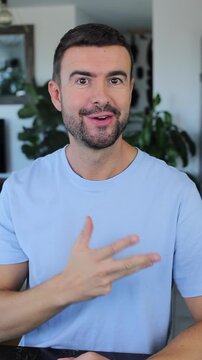 Man counting from 1 to 5 with his fingers 