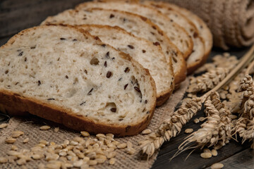 Whole grain and seeds sliced bread. Fresh bakery products. Design a poster for a kitchen or bakery.