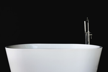 White luxury bathtub, with black wall