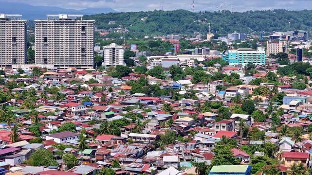 Sweeping aerial view over Davao City and the Davao River showcasing the entirety of Davao City.
