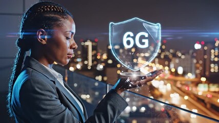 Businesswoman holds holographic 6G shield with smartphone in city office. Woman displays 6G technology hologram above phone. Professional shows 6G network shield hologram in modern office. - Powered by Adobe