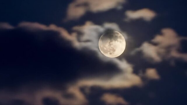 Ethereal lunar phases and shifting cloudscapes across the celestial canvas at night