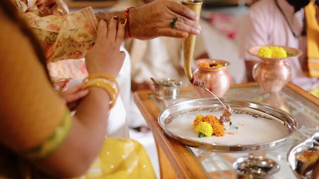 Authentic scene of a traditional Indian marriage vidhi, capturing sacred rituals performed around the holy fire (Agni) under a decorated mandap
