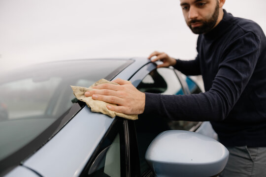 Car maintenance service washing car by hand