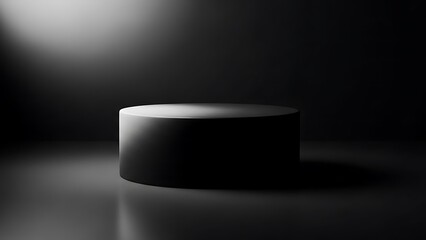 A solitary cylindrical pedestal illuminated by a dramatic spotlight in darkness