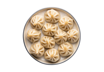 Steamed Chinese dumplings arranged in circular pattern on bamboo steamer plate, isolated on a transparent background