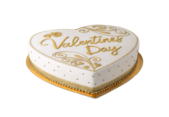 White heart-shaped cake decorated with gold Valentines Day lettering and ornate flourishes on platter, isolated on a transparent background