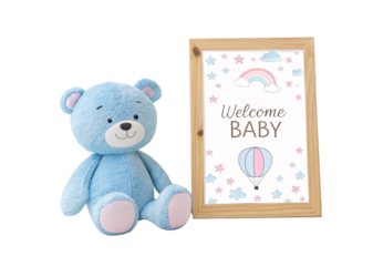 Blue teddy bear plush toy sitting beside wooden framed Welcome Baby nursery wall art sign, isolated on a transparent background