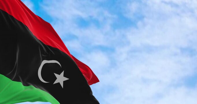 National flag of Libya waving on a clear day.