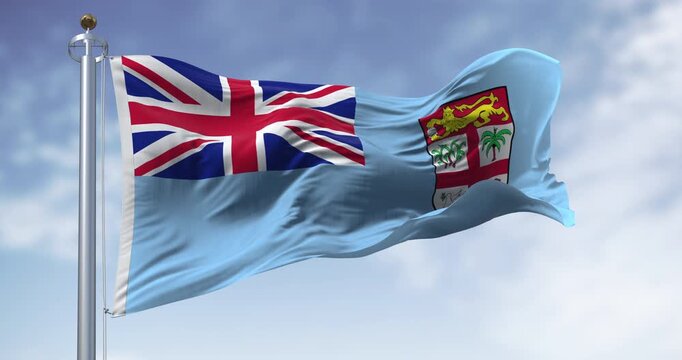 National flag of FIji waving in the wind on a clear day