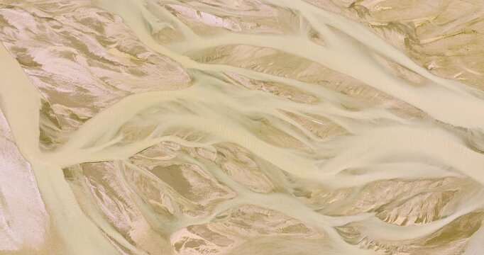 Aerial view of a river system in Landmannalaugar. The water creates stunning patterns against the light brown landscape, Landmannalaugar, Iceland.