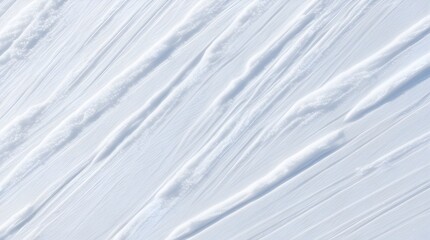 Dynamic parallel ski tracks forming a diagonal pattern on a pristine white snow surface, ideal for winter sports backgrounds and abstract textures.