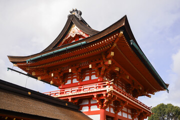 Fototapeta premium Kyoto. Traditional Japanese Temple Roof: Ornate Red and Gold Pavilion With Curved Eaves