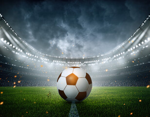 High energy football match in an outdoor stadium with fans cheering in the background during evening hours