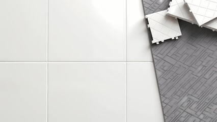 An aerial view of a white tiled wall next to a gray floor.