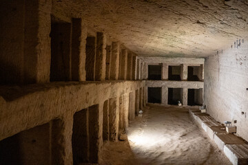 Burial niches along a wall of the Catacombs of Kom el Shoqafa in Alexandria, Egypt