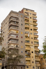 High rise apartment building across the street from the Catacombs of Kos el Shoqafa in Alexandria, Egypt