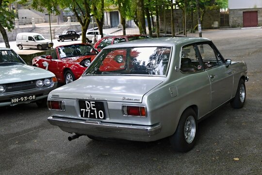 Datsun 1200 classic car parked at a car show