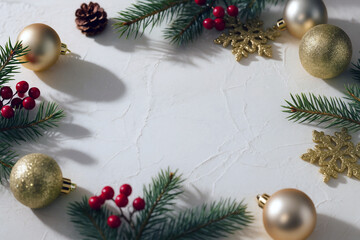 Elegant Christmas Frame with Gold Ornaments, Red Berries, and Pine Branches