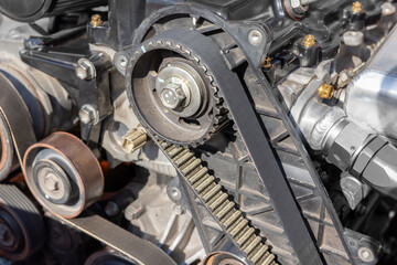 Close-up of Timing Belt and Crankshaft Sprocket with Alignment Mark in Car Engine Bay