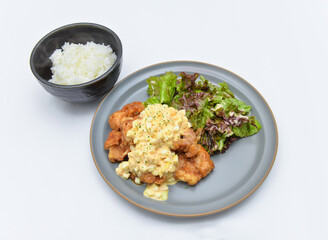 Delicious Japanese Chicken Nanban dish with fluffy white rice and fresh garden greens ready to eat