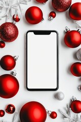 Smartphone with blank white display top view with red baubles on background.