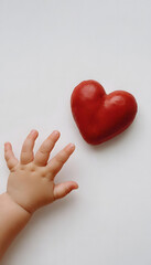 heart in baby hand