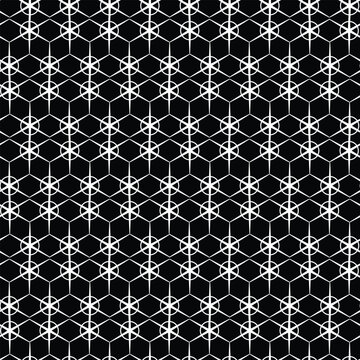 A geometric pattern featuring interlocking hexagons and circles on a black background.