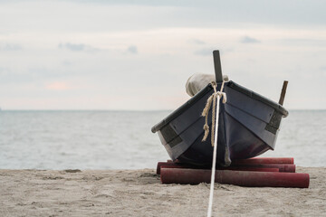 relaxing beach scene with boat by the sea